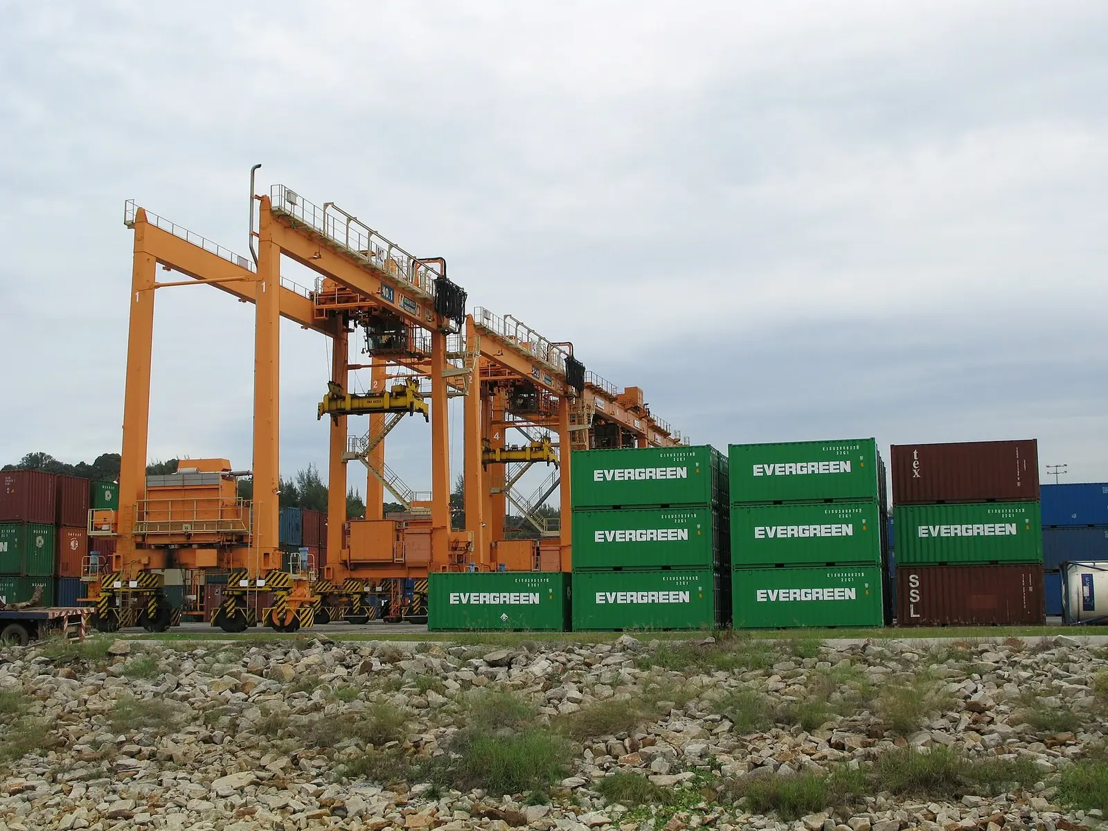 Stacked freight containers served by a rubber tyre gantry crane