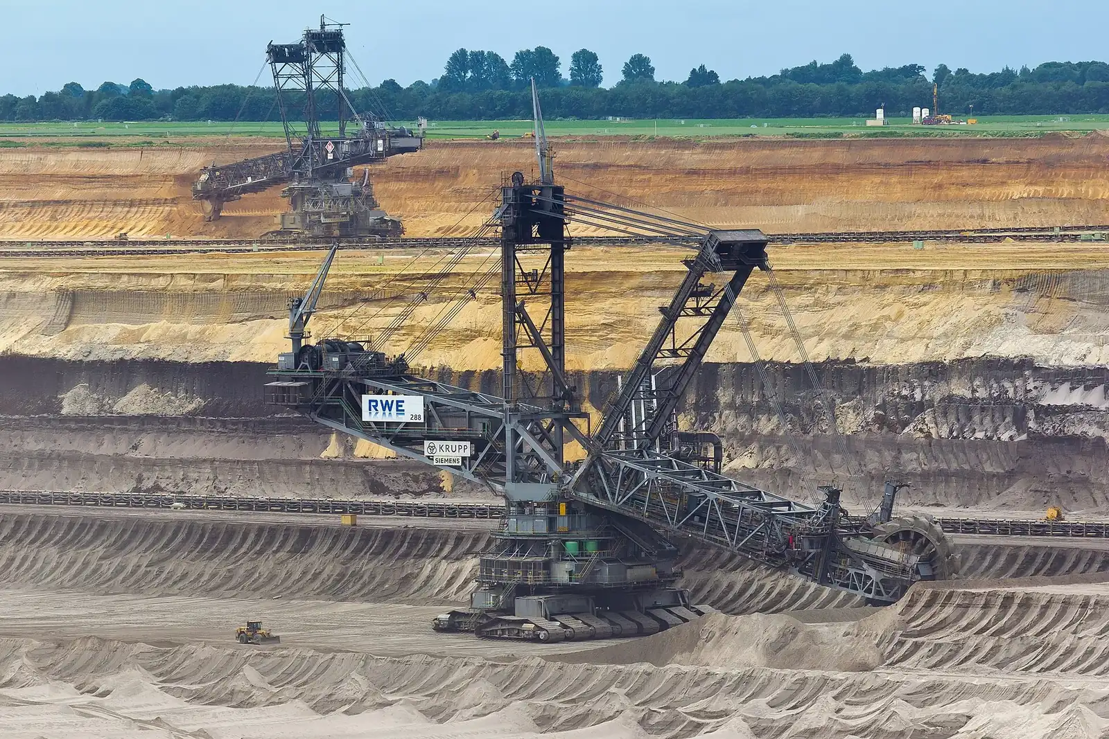Heavy extraction equipment at an open mining operation